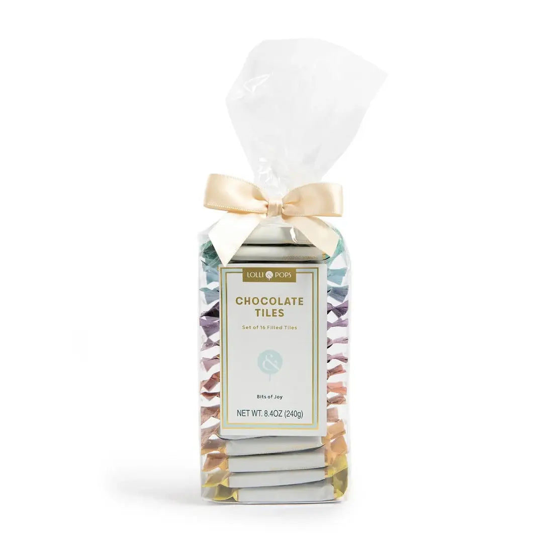 Packaged chocolate tiles with a bow on a white background