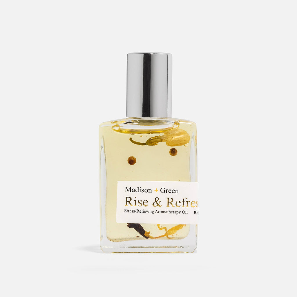 Bottle of Madison & Green Rise & Refine Aromatherapy Oil on a white background