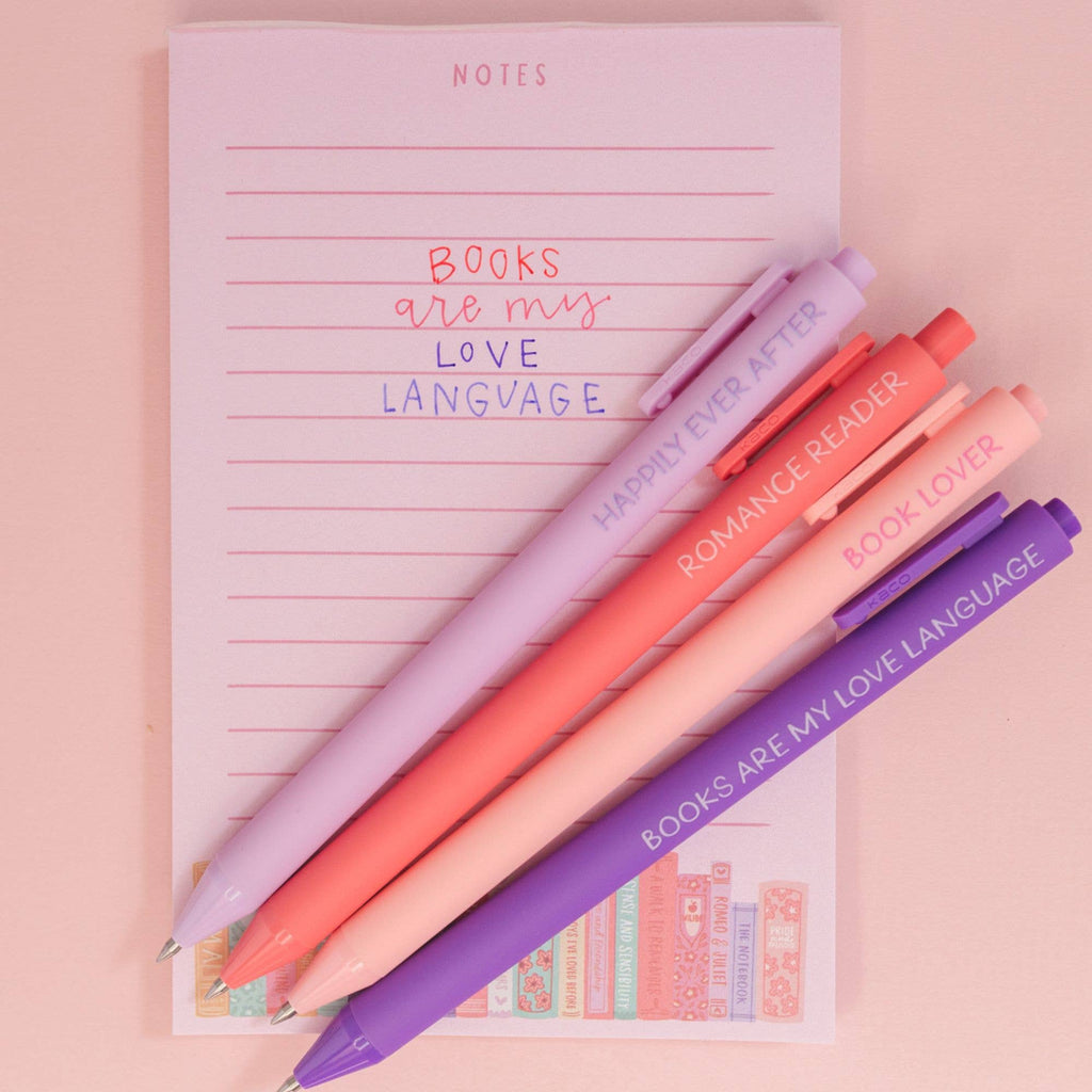 Book Lover gel pens laid on a notebook ready for journaling.