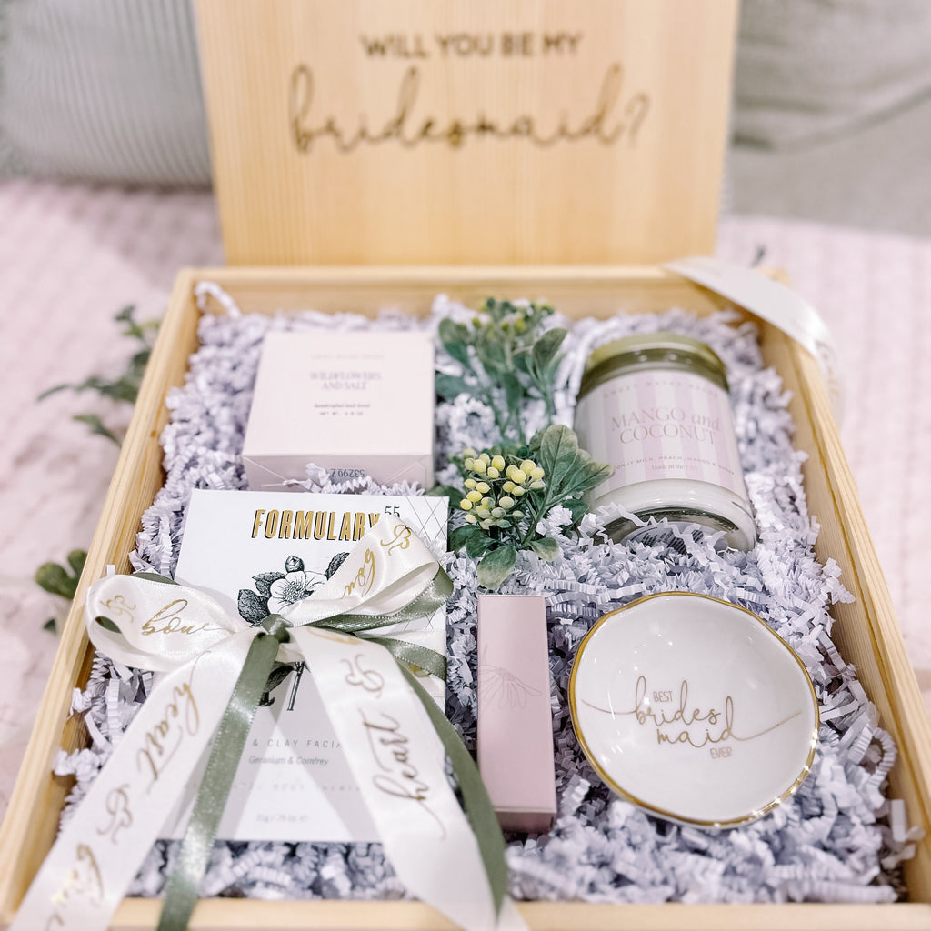 Gift box with 'Will you be my bridesmaid?' message and various items inside.