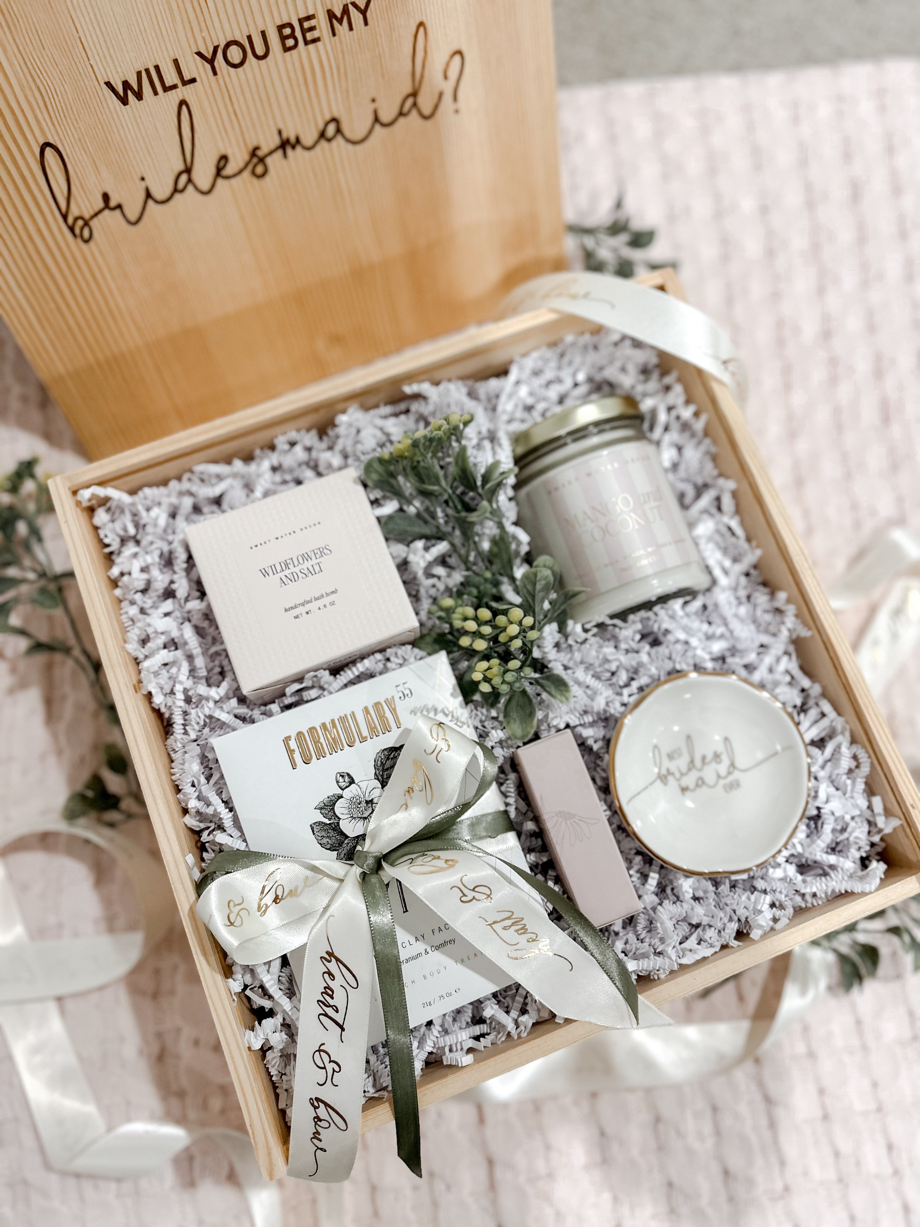 Gift box with 'Will You Be My Bridesmaid?' message, soap, candle, and other items.