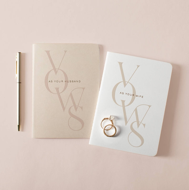 Elegant wedding vow book set for the bride and groom with gold diamond pen and wedding rings, beautifully designed for writing heartfelt vows and preserving lifelong memories.
