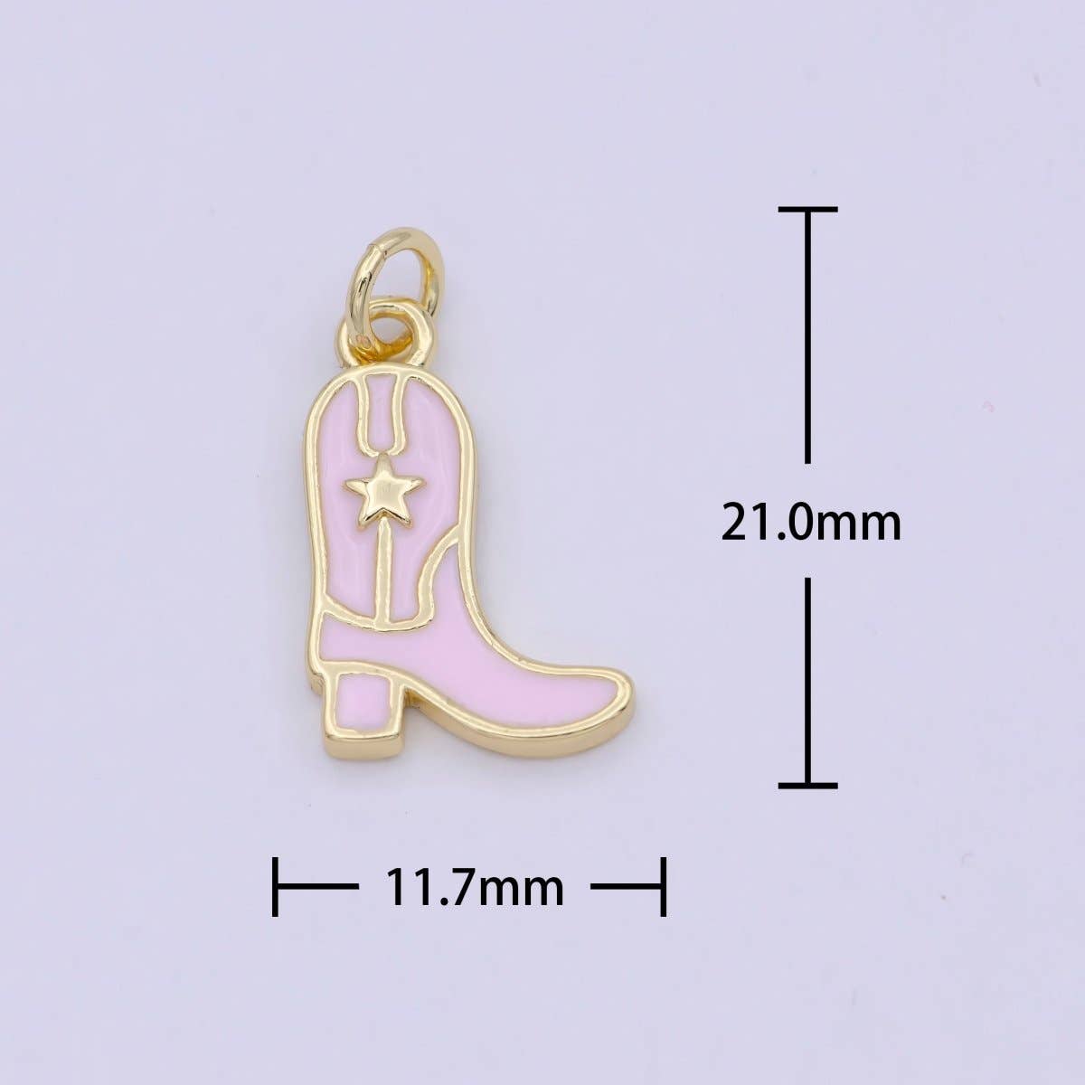 Pink cowboy boot charm with gold outline and star on a light purple background, showing measurements.