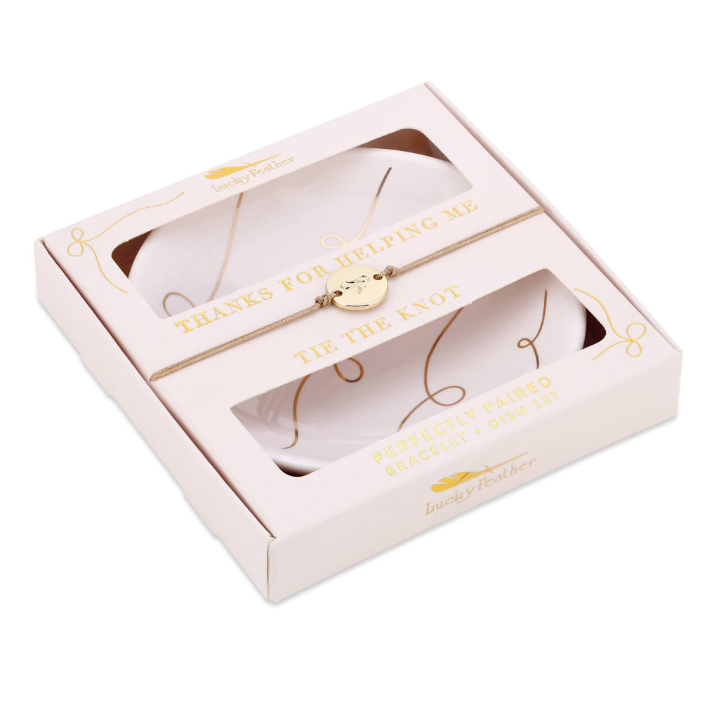 Gold bracelet in a decorative box with text