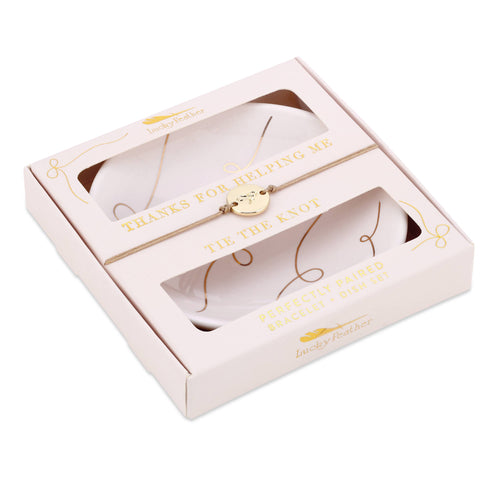 Gold bracelet in a decorative box with text