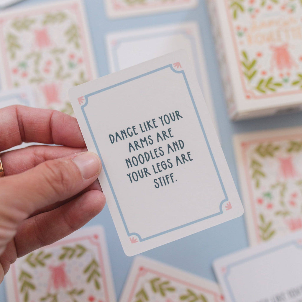 Close-up of Dancer Roulette cards with rose gold foil accents.