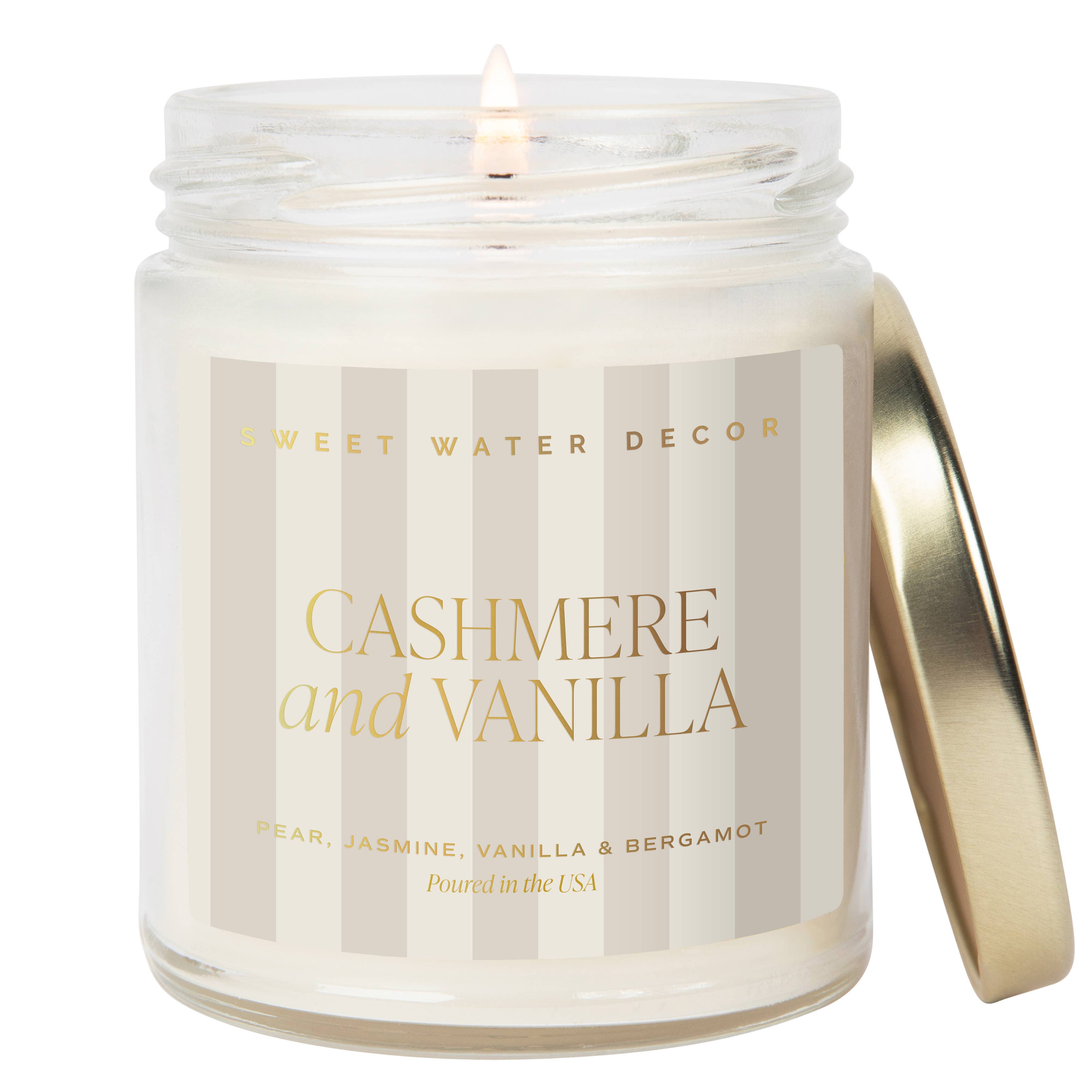 Candle in a glass jar labeled 'Cashmere and Vanilla' by Sweet Water Decor on a white background.