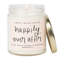 Candle in a glass jar with a gold lid labeled 'Happily Ever After' by Sweet Water Decor.