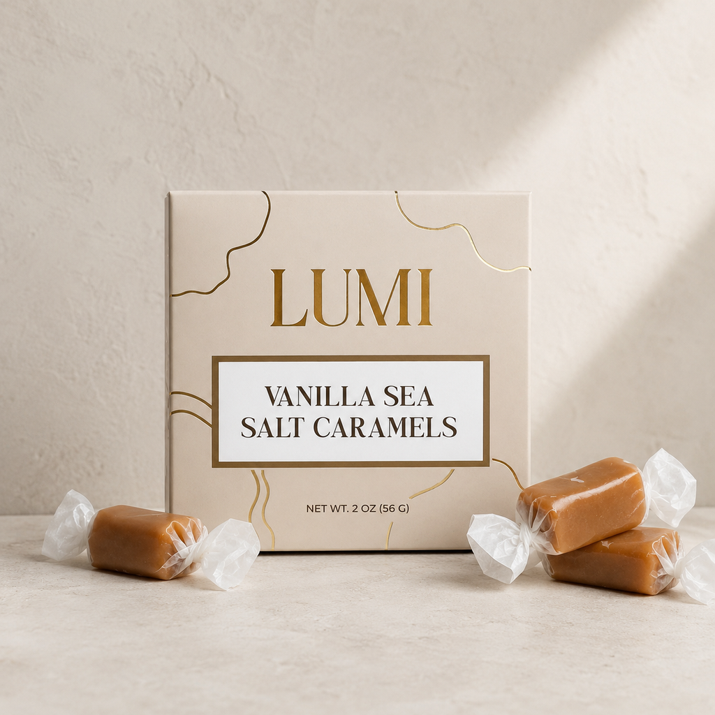 Lumi Vanilla Sea Salt Caramels packaging with caramels on a neutral background