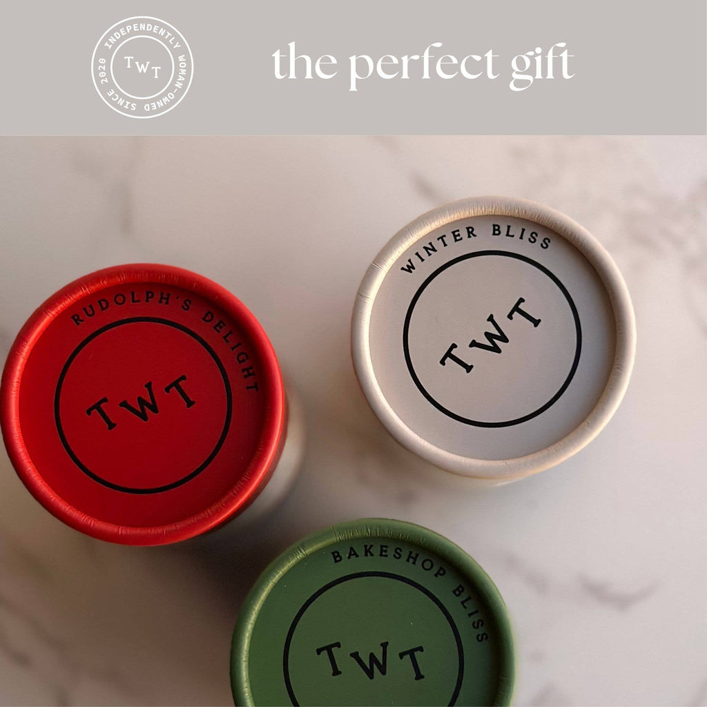 Three containers with 'TWT' branding on a marble surface, featuring a red, white, and green lid.