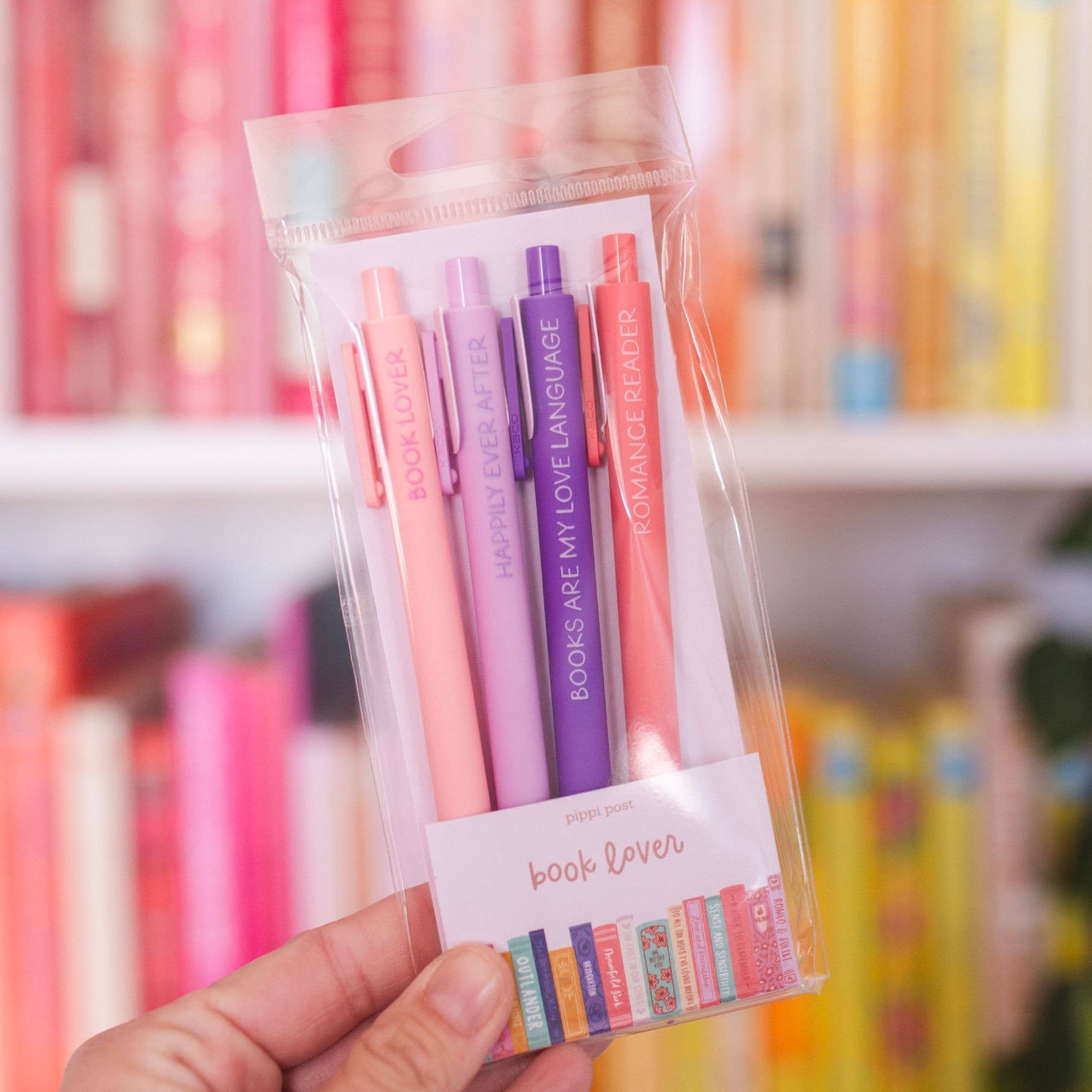 Book Lover gel pens displayed in a pen holder on a bookshelf.