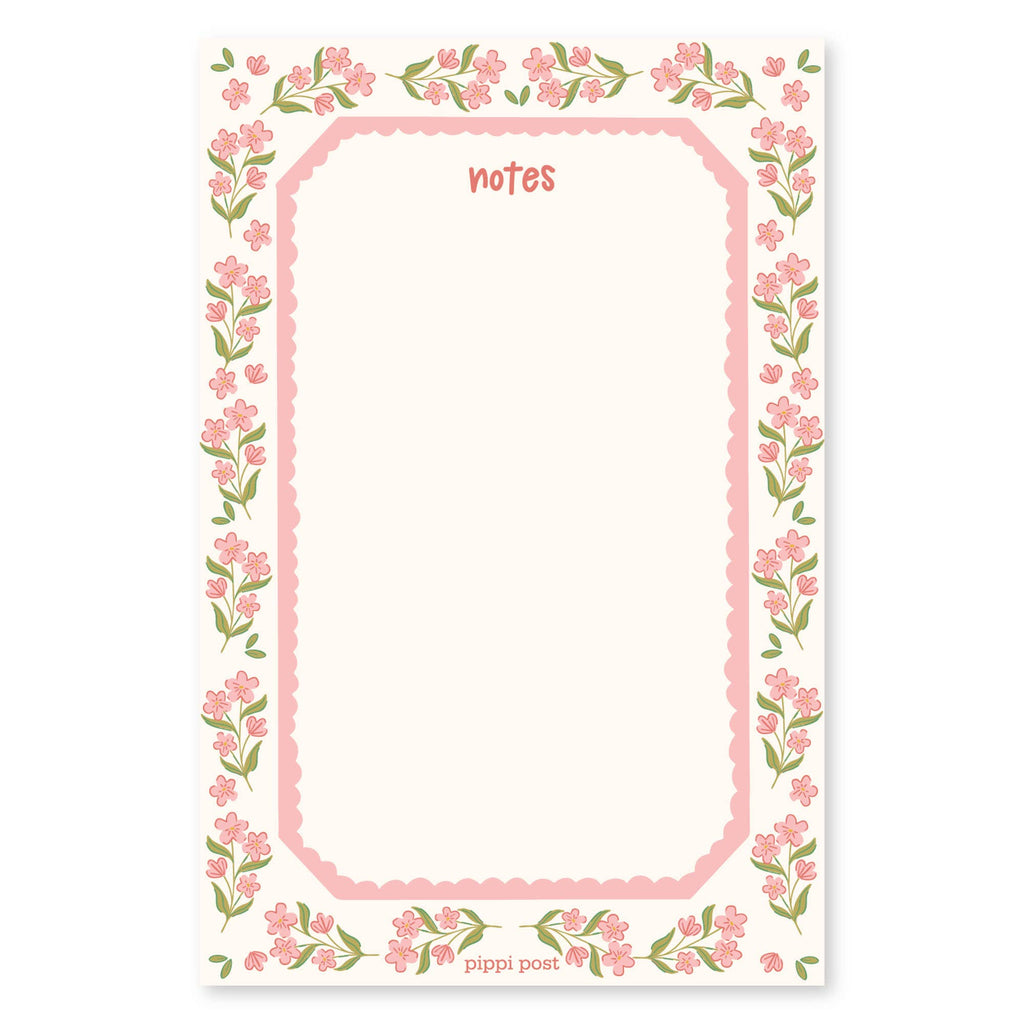 A floral notepad page with a pink border, green leaves, and pink flowers around a blank writing area labeled 'notes' at the top and 'pippi post' at the bottom.