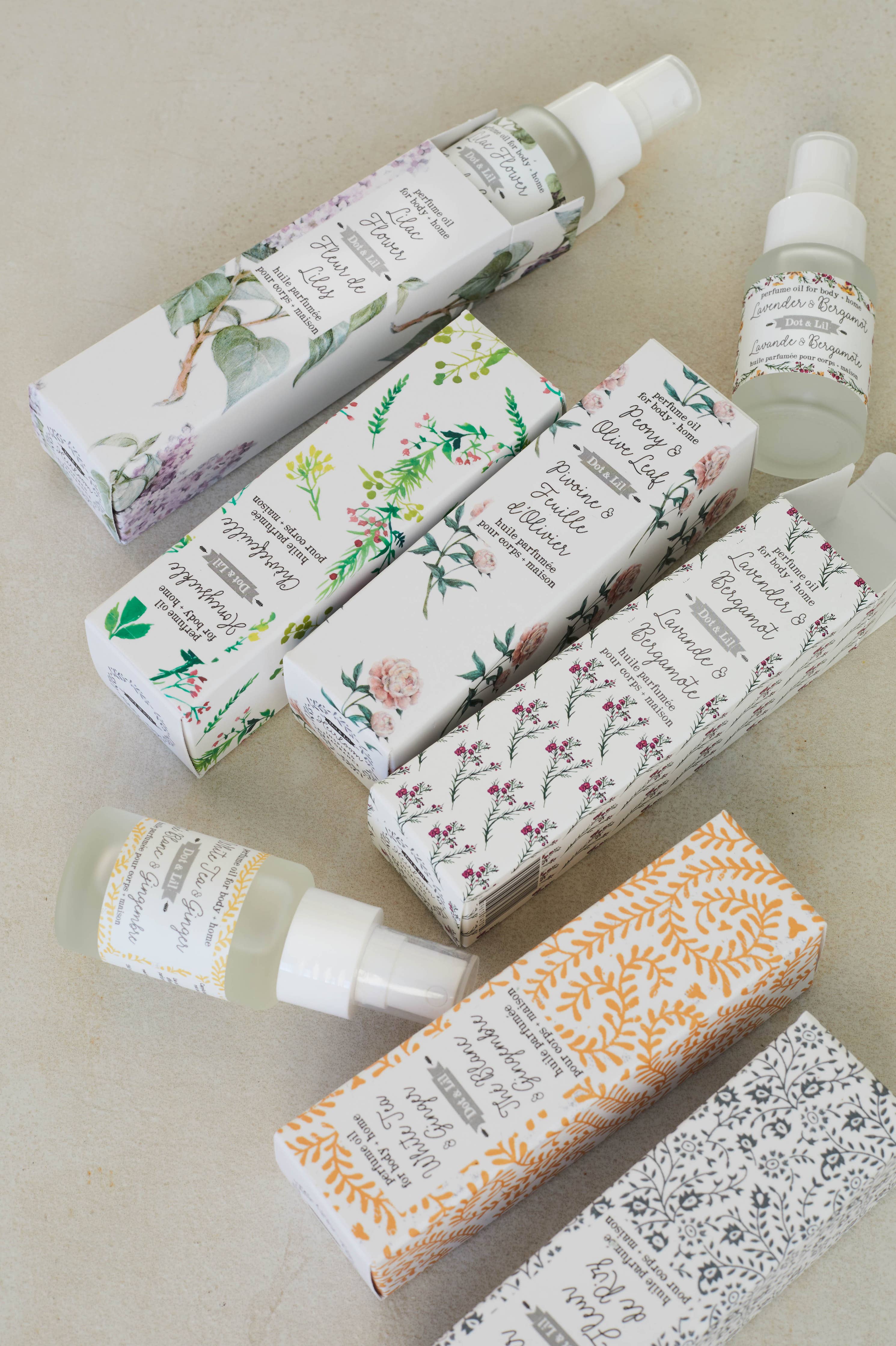 Set of skincare products with floral packaging on a neutral background