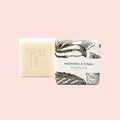 Bar of soap with decorative packaging on a white background