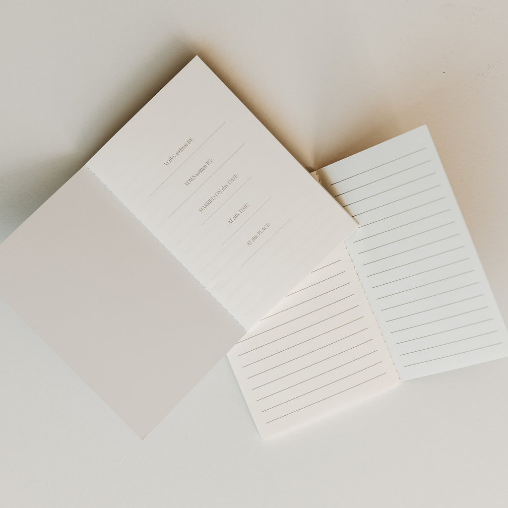 White stationery set with a letter and two envelopes on a light background