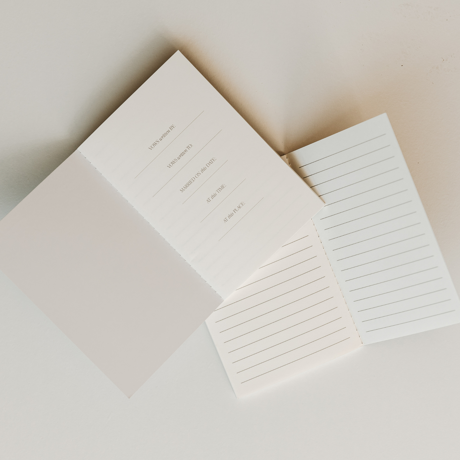 White stationery set with a letter and two envelopes on a light background