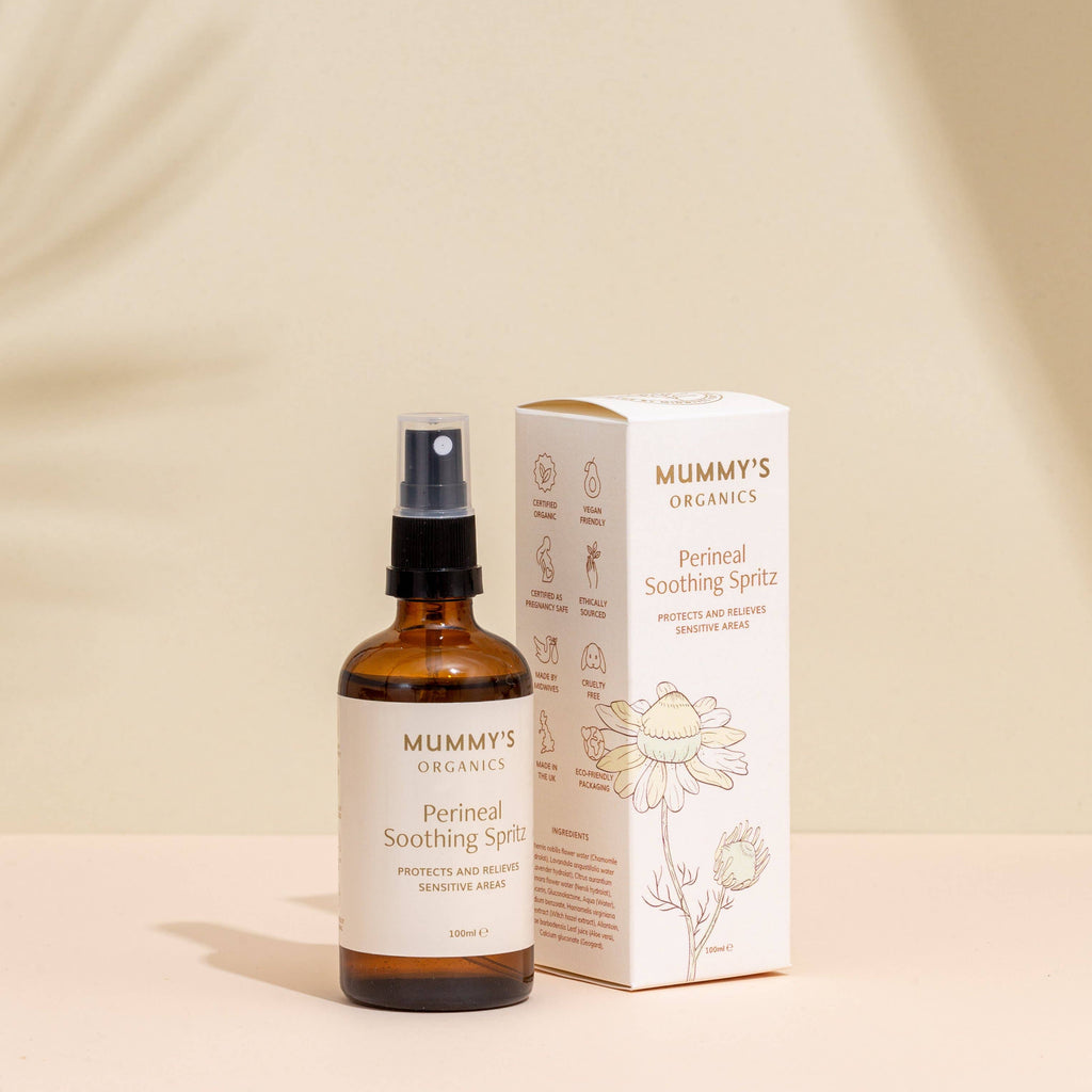 Mummy's Organics Perineal Soothing Spray bottle and packaging on a beige background