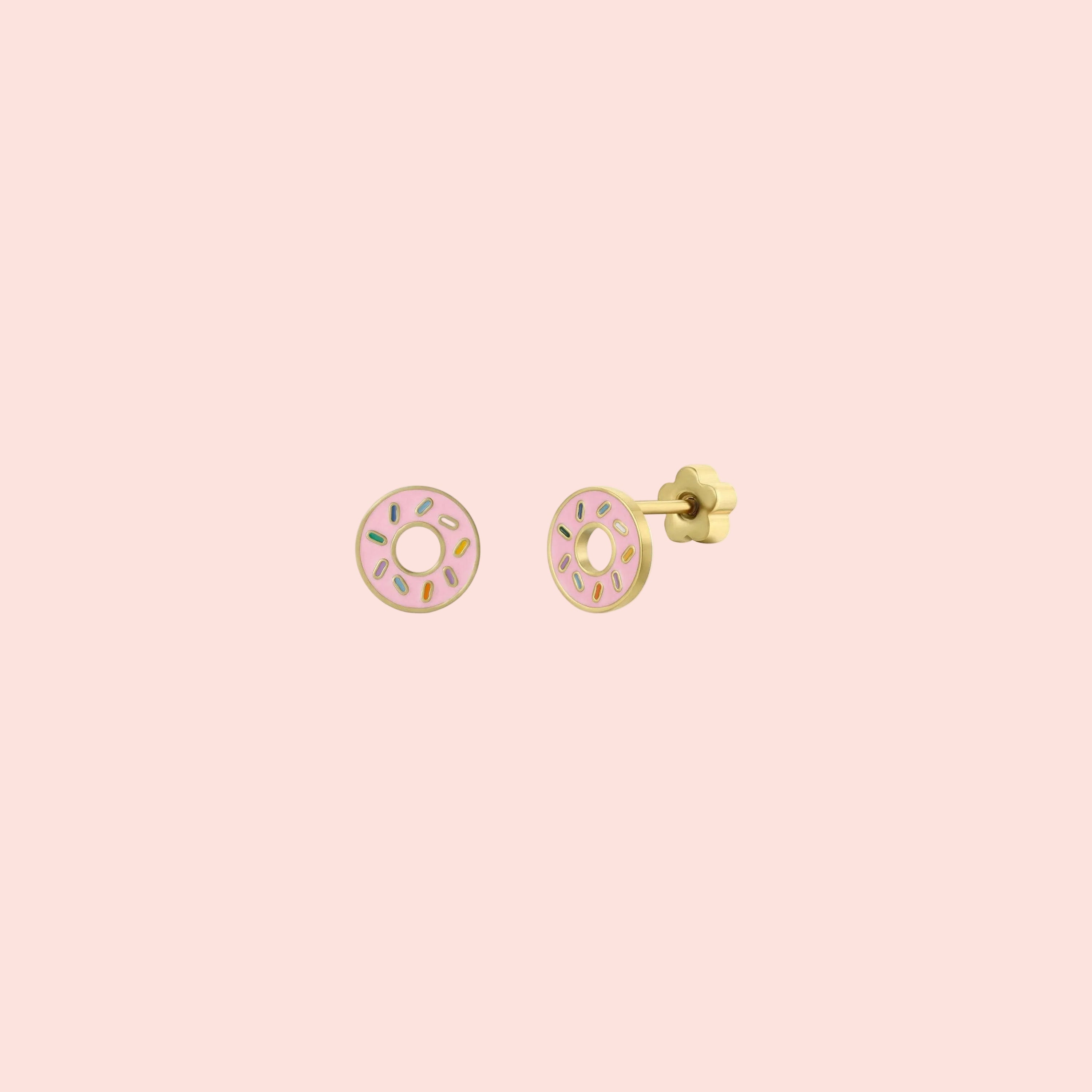 Pair of pink donut-shaped earrings on a white background
