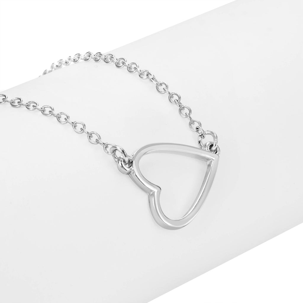 Silver heart-shaped pendant on a chain against a white background