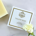 Clara & Fritz tallow soap bar with packaging and a white rose on a light background
