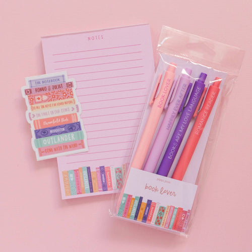 Book Lover gel pens laid on a notebook ready for journaling.