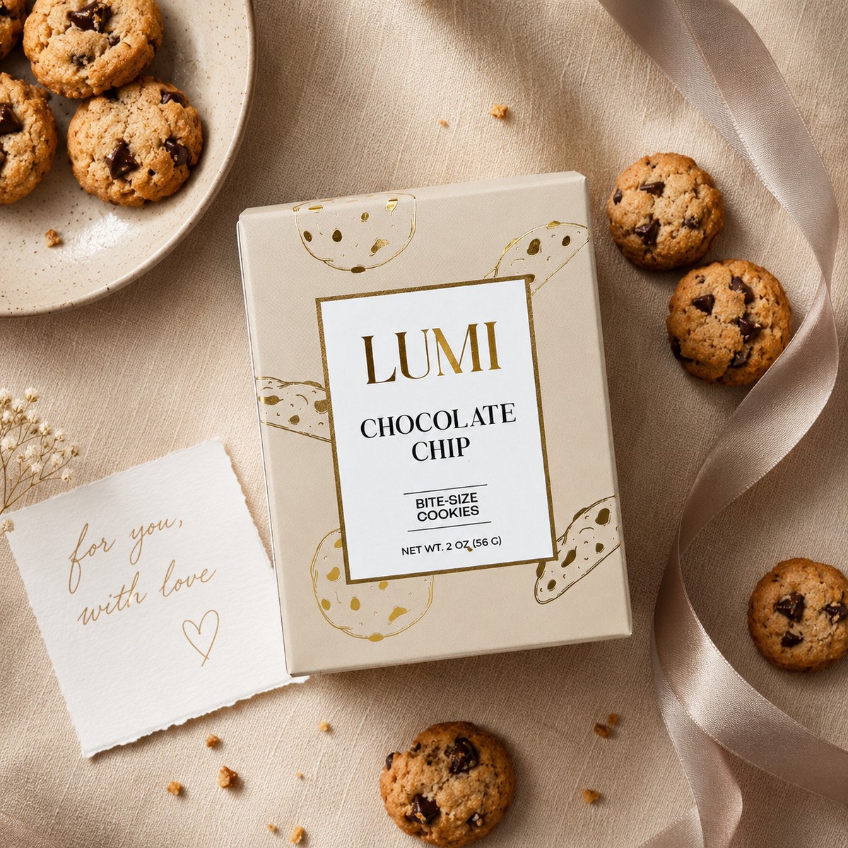 Lumi chocolate chip cookie box with cookies on a beige surface