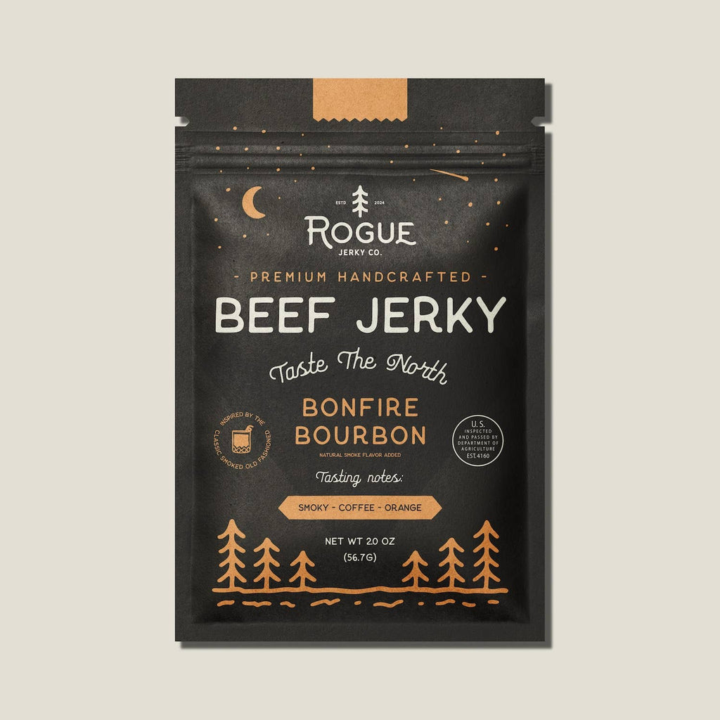 Packaging of Rogue Beef Jerky with 'Bonfire Bourbon' flavor on a beige background
