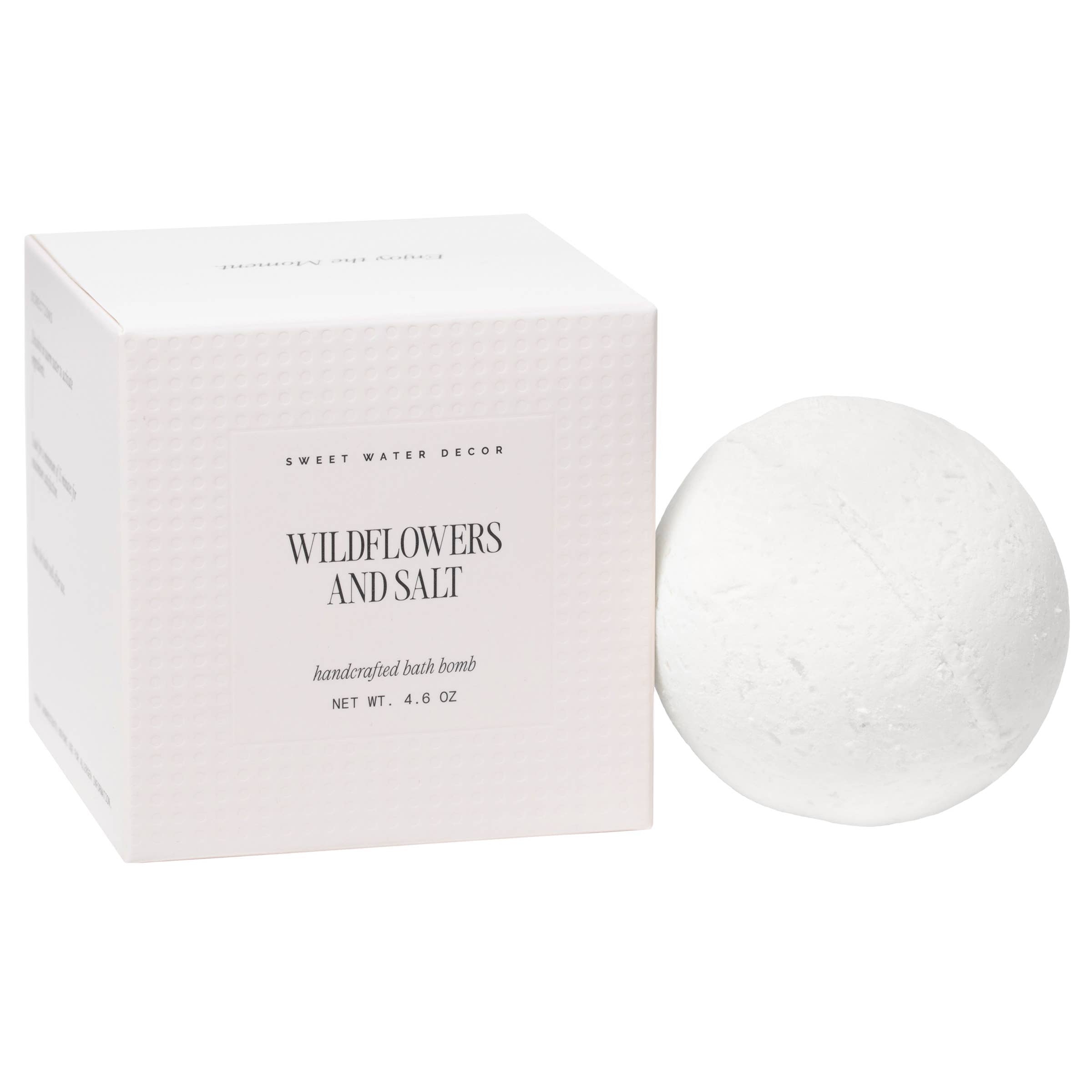 Bath bomb with packaging labeled 'Wildflowers and Salt' on a white background