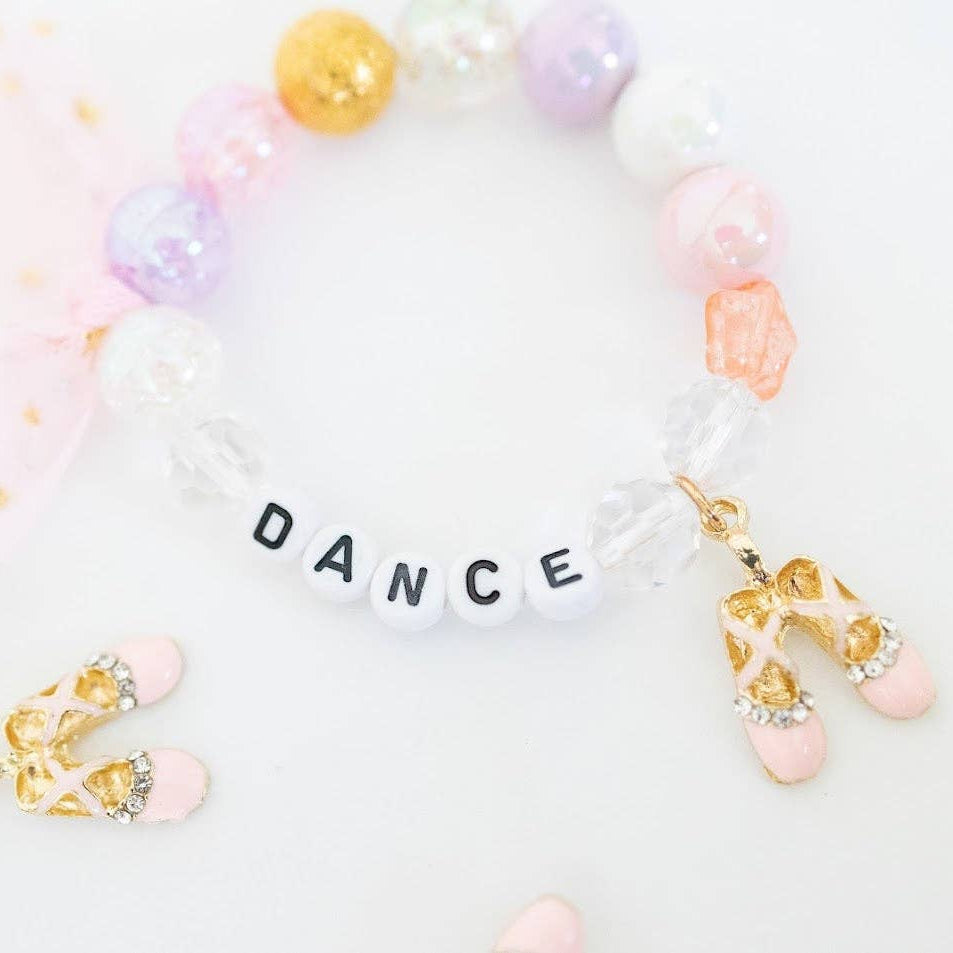 Bracelet with 'DANCE' letters and colorful beads on a white background